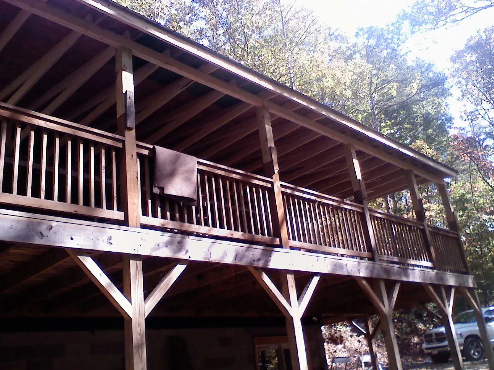 Timber framing under a new elevated porch and deck — Roof Leak Repair in Yoder by Roofing Brothers